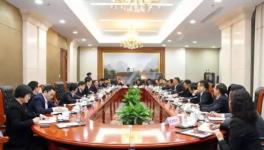 高登榜會見周龍山 海螺與華潤水泥或?qū)⒀由旌献黝I(lǐng)域