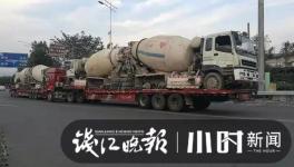 巨無霸來了！半掛車“背”著水泥車欲上高速！